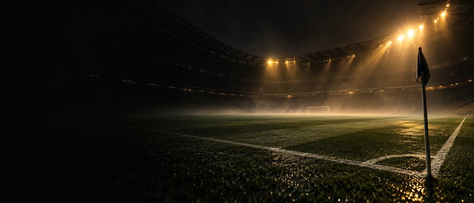 Estadio de fútbol iluminado de noche